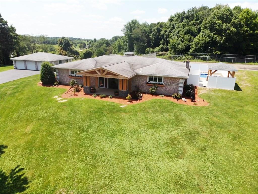 431 Old Rt 21 Road McClellandtown, PA 15458 - Photo 2 of 25 a view of a house with a yard porch and sitting area