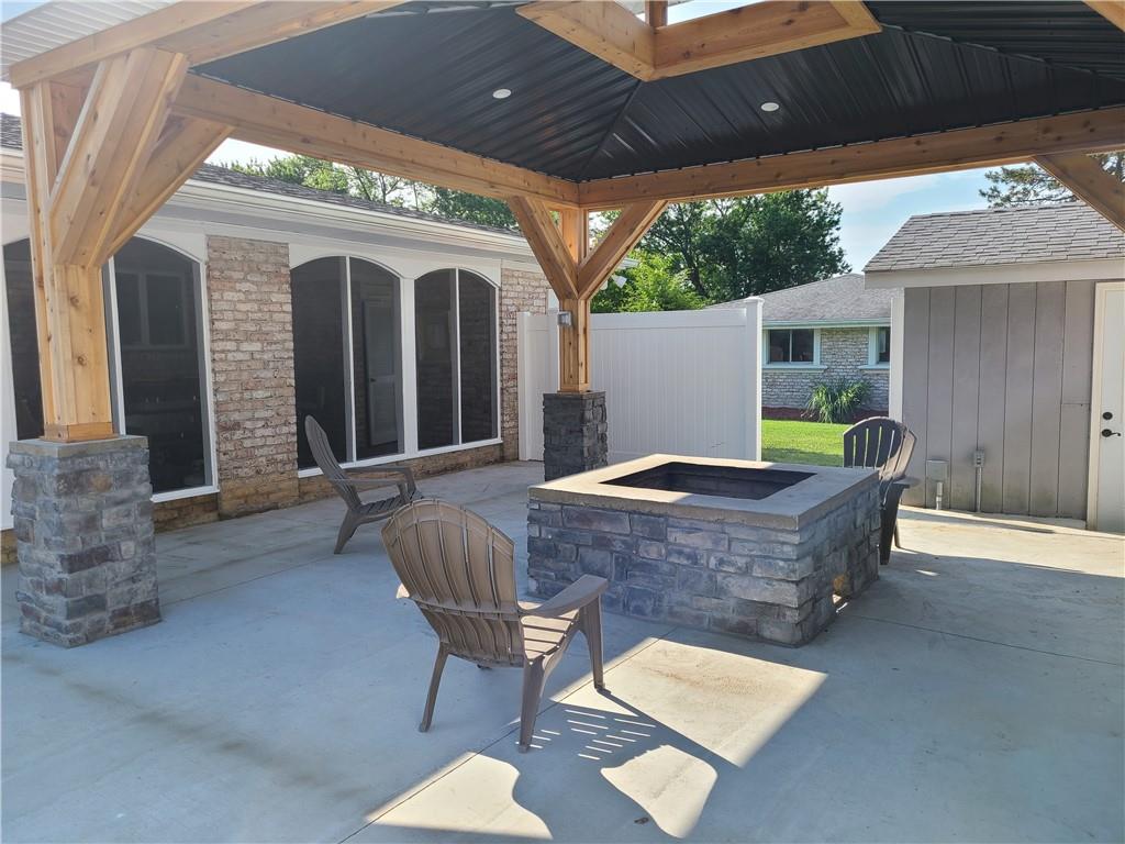 431 Old Rt 21 Road McClellandtown, PA 15458 - Photo 25 of 25 a view of a patio with table and chairs with wooden floor and fence
