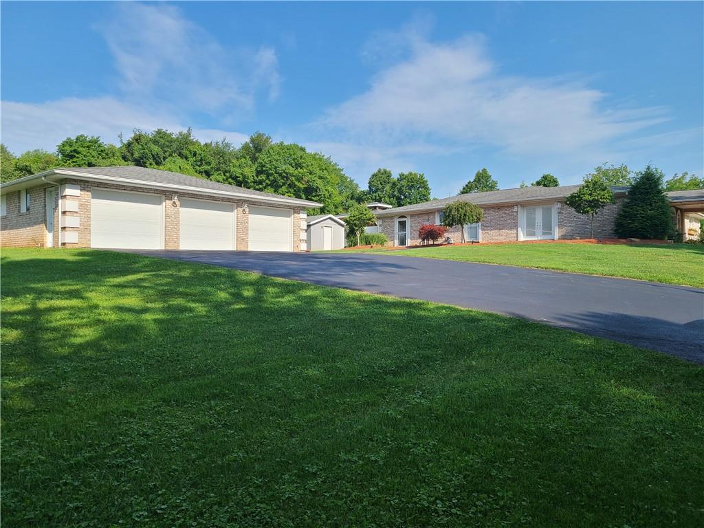 431 Old Rt 21 Road McClellandtown, PA 15458 - Photo 4 of 25 a front view of a house with a yard and lake view
