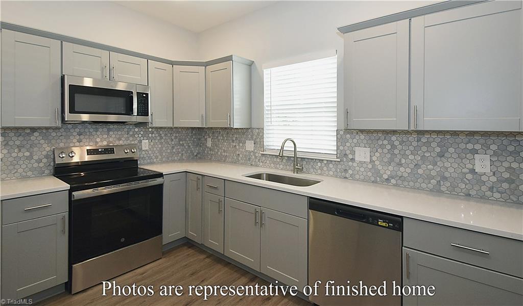 3429 Littlefield Way Greensboro, NC 27405 - Photo 12 of 40 The expansive counter space is on par with the cabinet space.