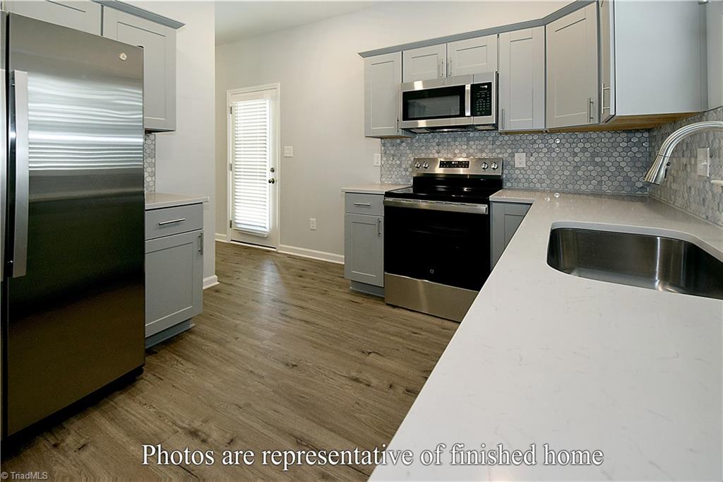 3429 Littlefield Way Greensboro, NC 27405 - Photo 13 of 40 The design of this kitchen is perfection, allowing for a super efficient work flow.