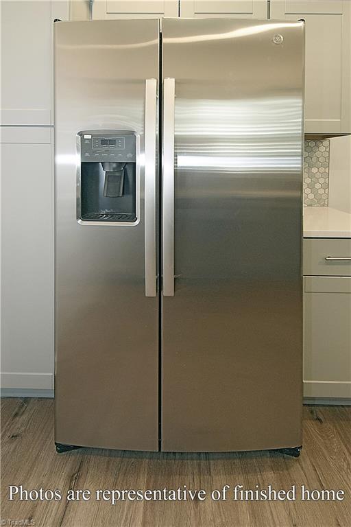 3429 Littlefield Way Greensboro, NC 27405 - Photo 17 of 40 The upgrades in this home include a side by side stainless steel GE refrigerator.