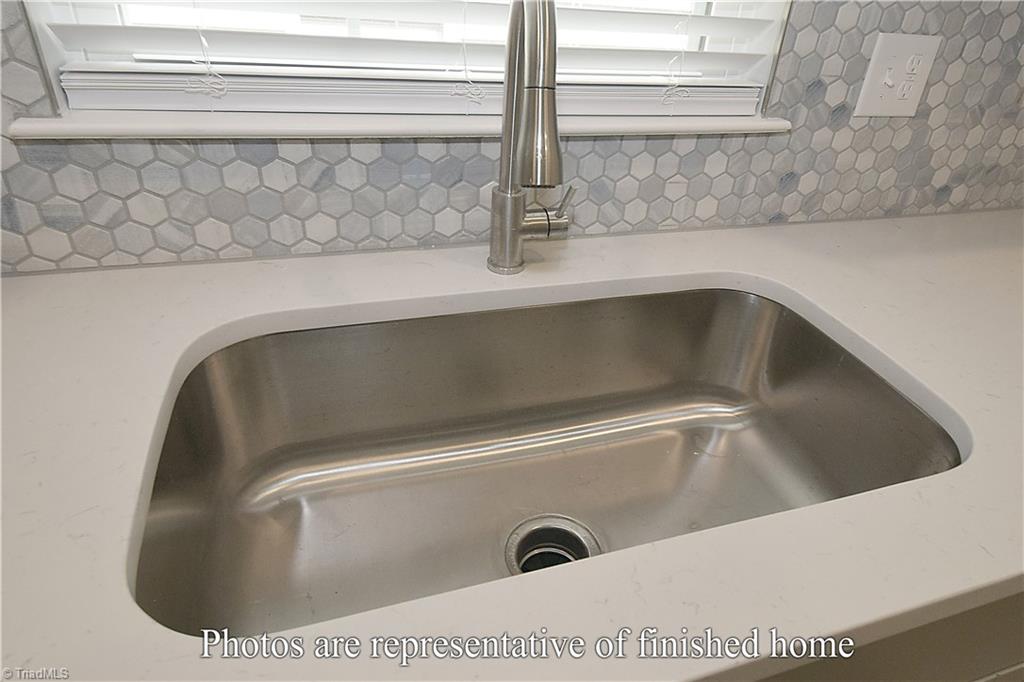 3429 Littlefield Way Greensboro, NC 27405 - Photo 20 of 40 The large window lit sink is mounted under-counter.
