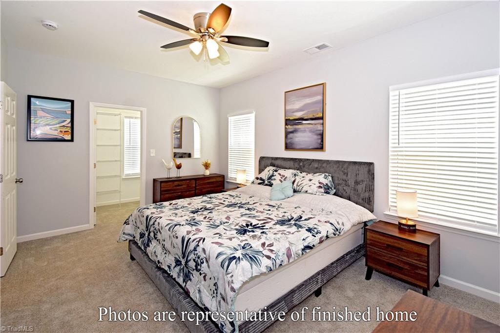 3429 Littlefield Way Greensboro, NC 27405 - Photo 25 of 40 The incredible primary suite stretches all the way from the front to the rear of the home!