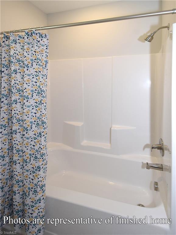 3429 Littlefield Way Greensboro, NC 27405 - Photo 30 of 40 The bath/shower area is filled with natural light. Nice!