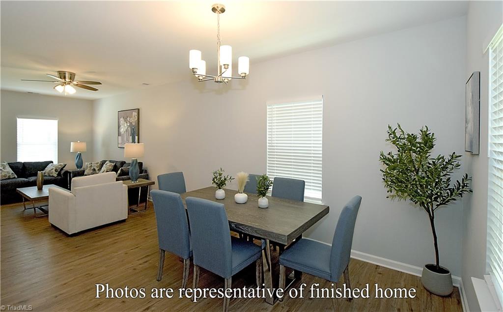 3429 Littlefield Way Greensboro, NC 27405 - Photo 6 of 40 The living and dining rooms create a wonderful open space that stretches from the front all the way to the rear of the home!