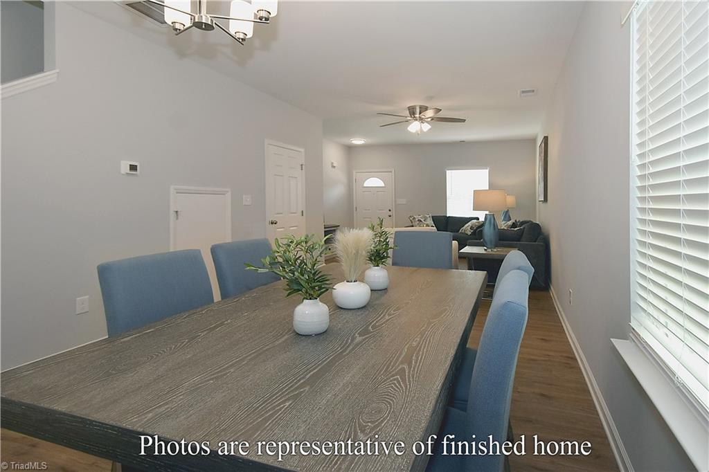 3429 Littlefield Way Greensboro, NC 27405 - Photo 7 of 40 This large table that is staged here shows the incredible amount of room!