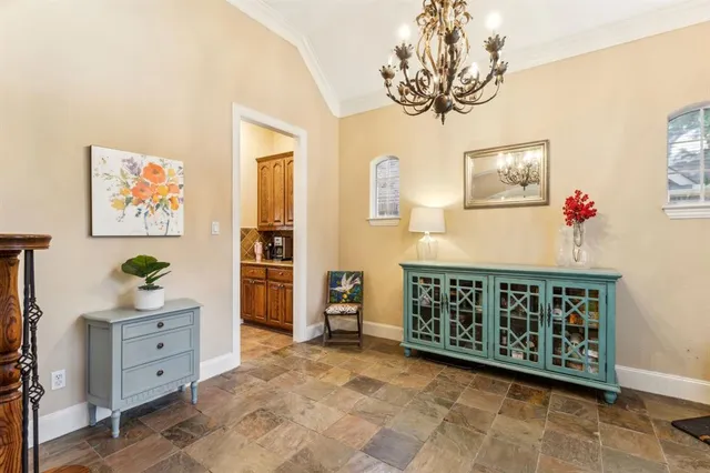 a view of a bedroom with furniture and wooden floor
