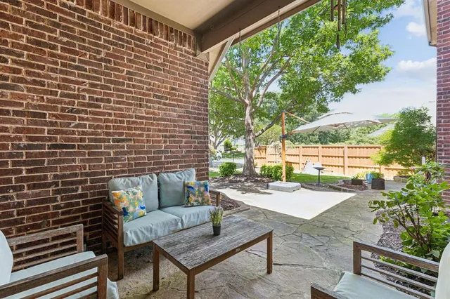 a backyard of a house with outdoor seating