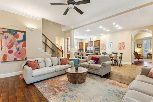 a living room with furniture or wooden floor and a chandelier
