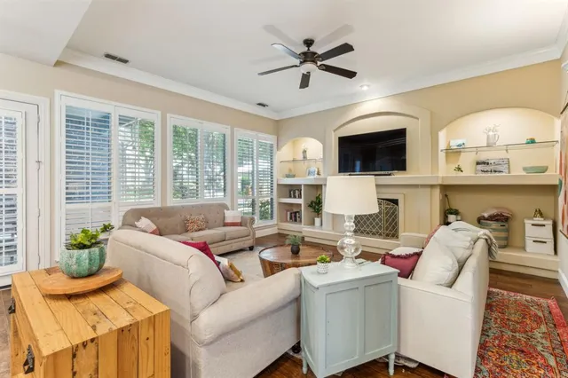 a living room with furniture fireplace and a flat screen tv