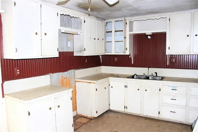 a bathroom with a sink double vanity and a mirror