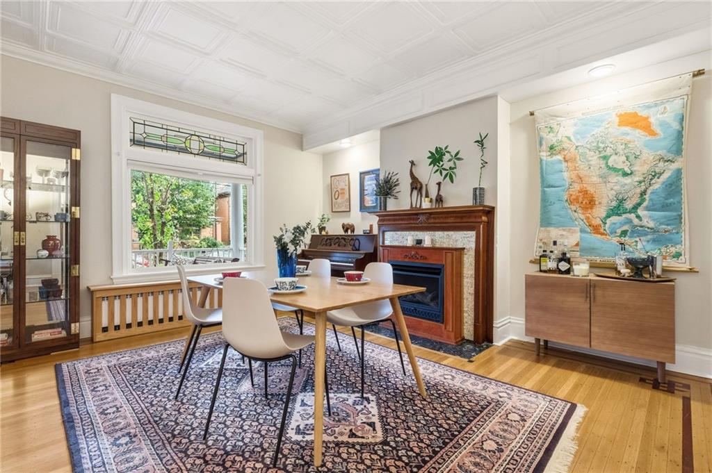 1127 Portland Street Pittsburgh, PA 15206 - Photo 12 of 50 a living room with furniture and a fireplace