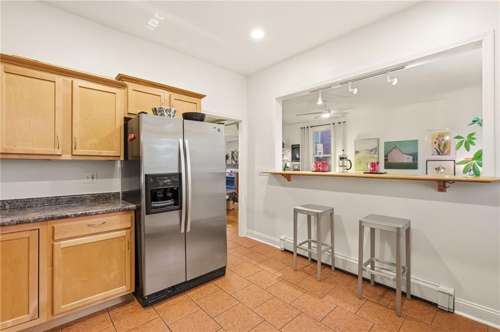 1127 Portland Street Pittsburgh, PA 15206 - Photo 14 of 50 a kitchen with stainless steel appliances a refrigerator sink and cabinets
