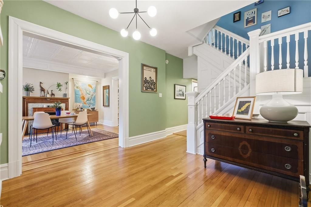 1127 Portland Street Pittsburgh, PA 15206 - Photo 17 of 50 a living room with furniture and a wooden floor
