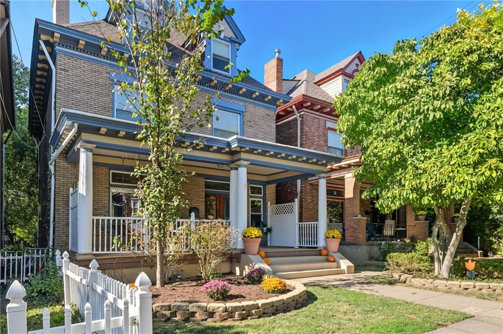 1127 Portland Street Pittsburgh, PA 15206 - Photo 2 of 50 a front view of a house with a yard fountain and a tree