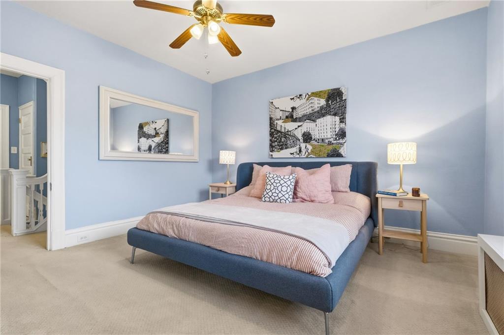 1127 Portland Street Pittsburgh, PA 15206 - Photo 23 of 50 a bedroom with a bed and painting on the wall