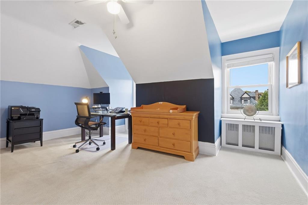 1127 Portland Street Pittsburgh, PA 15206 - Photo 34 of 50 a bedroom with furniture and a desk