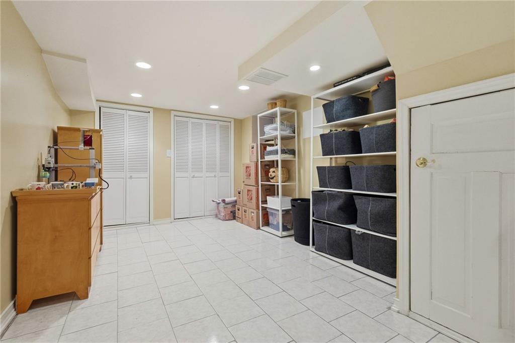 1127 Portland Street Pittsburgh, PA 15206 - Photo 40 of 50 a room with a walk in closet and wooden shelves