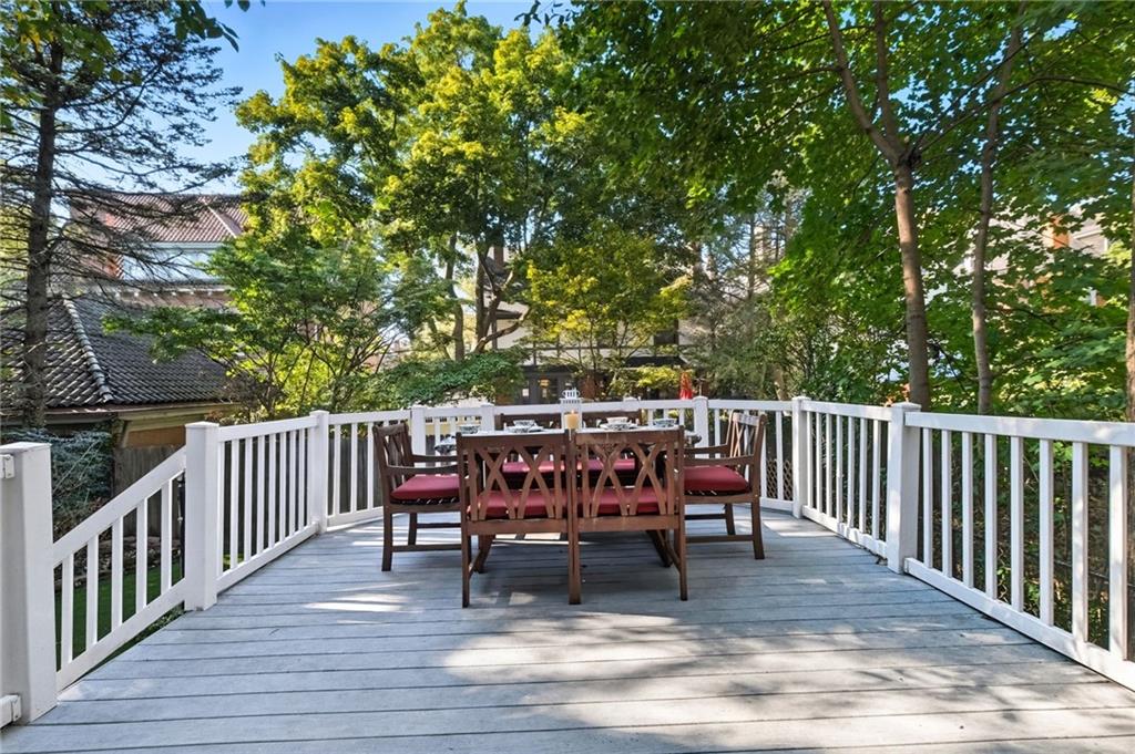 1127 Portland Street Pittsburgh, PA 15206 - Photo 44 of 50 a view of a chairs and table on the wooden floor