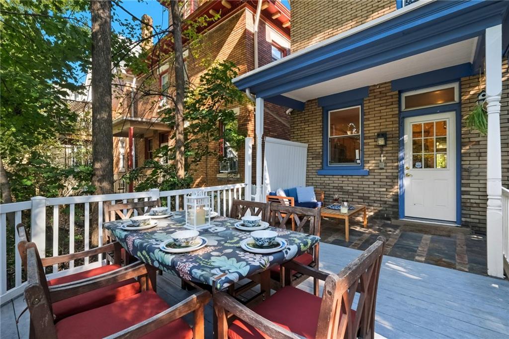 1127 Portland Street Pittsburgh, PA 15206 - Photo 46 of 50 a view of a dinning tables and chairs in deck