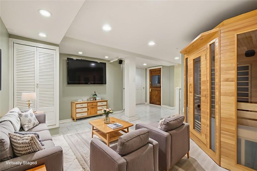 1127 Portland Street Pittsburgh, PA 15206 - Photo 48 of 50 a living room with furniture and a flat screen tv