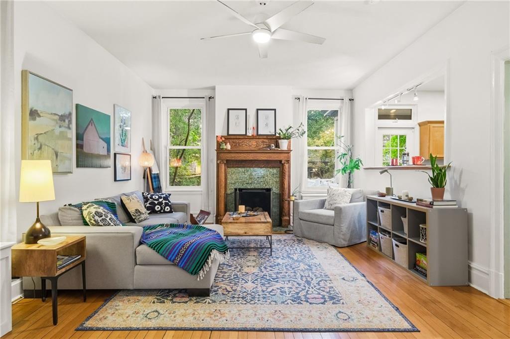 1127 Portland Street Pittsburgh, PA 15206 - Photo 5 of 50 a living room with furniture and a fireplace