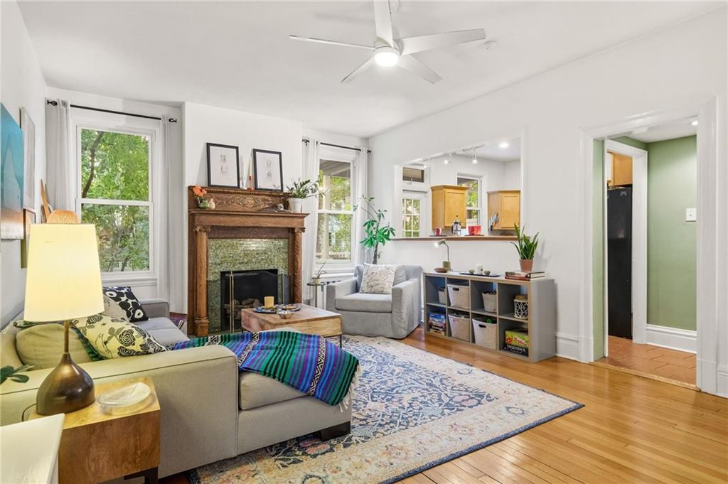 1127 Portland Street Pittsburgh, PA 15206 - Photo 7 of 50 a living room with furniture and a fireplace