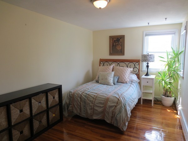 30 Sachem Road Needham, MA 02494 - Photo 11 of 19 a bedroom with a bed table and a window
