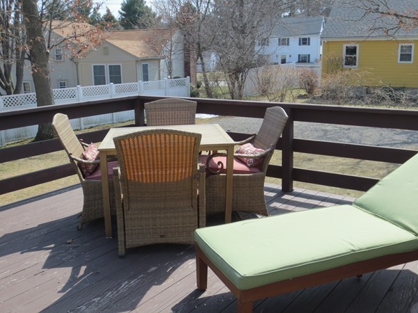 30 Sachem Road Needham, MA 02494 - Photo 16 of 19 a view of a patio with table and chairs with wooden floor and fence