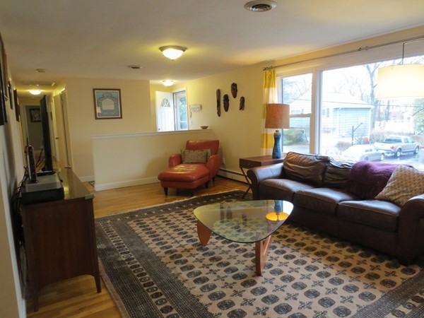 30 Sachem Road Needham, MA 02494 - Photo 2 of 19 a living room with furniture and a flat screen tv