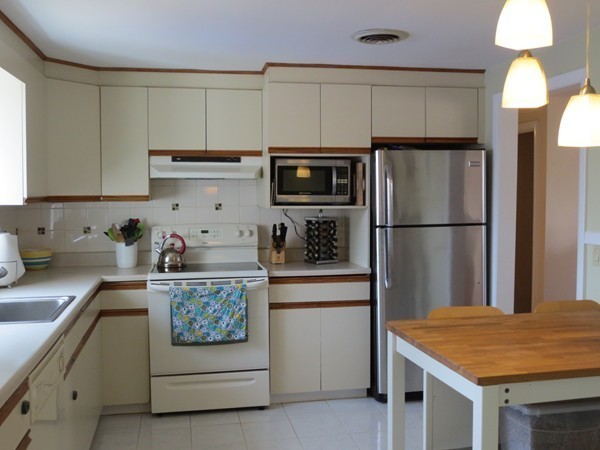 30 Sachem Road Needham, MA 02494 - Photo 5 of 19 a kitchen with a sink a stove and refrigerator