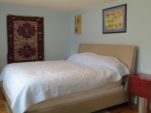 30 Sachem Road Needham, MA 02494 - Photo 7 of 19 a large bed sitting in a bedroom next to a window