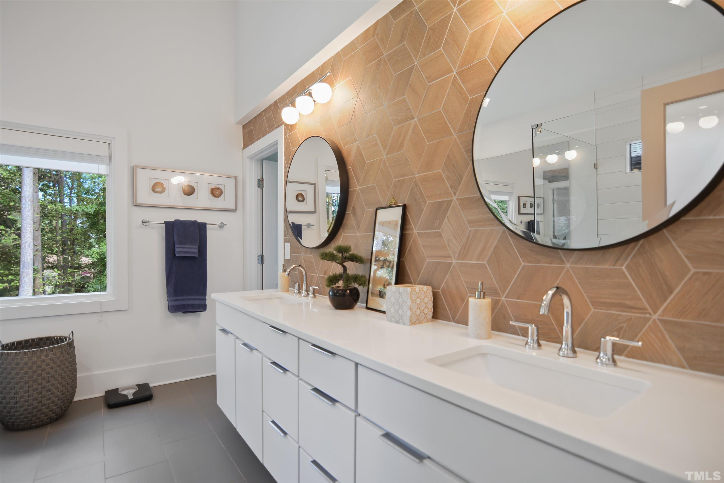 3210 Hampton Road Raleigh, NC 27607 - Photo 13 of 34 a bathroom with a double vanity sink and a mirror