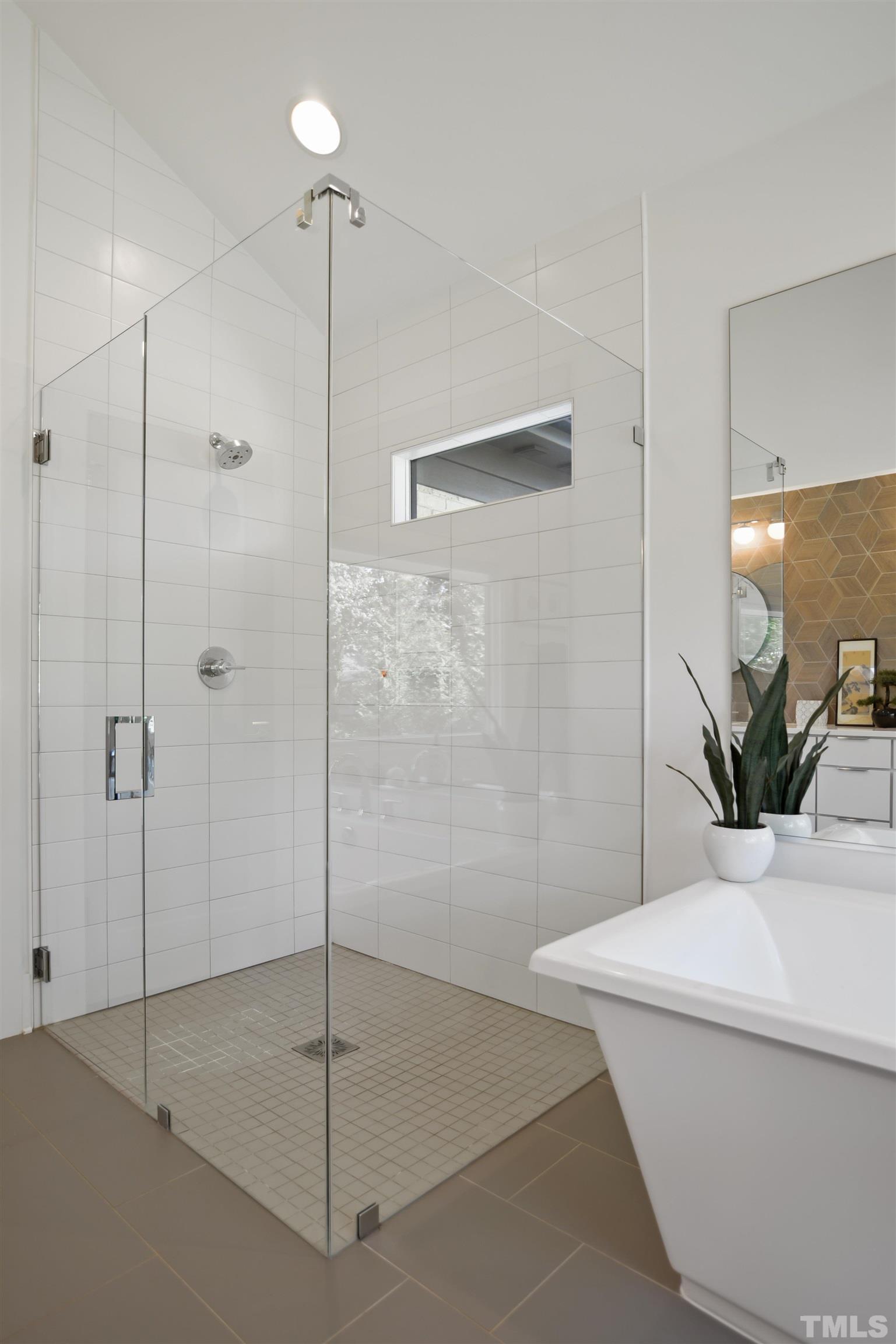 3210 Hampton Road Raleigh, NC 27607 - Photo 15 of 34 a bathroom with a shower and a sink