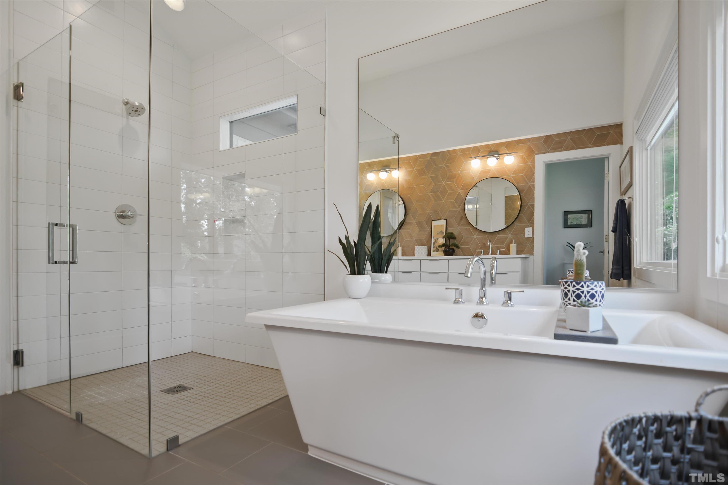 3210 Hampton Road Raleigh, NC 27607 - Photo 16 of 34 a bathroom with a double vanity sink mirror and shower