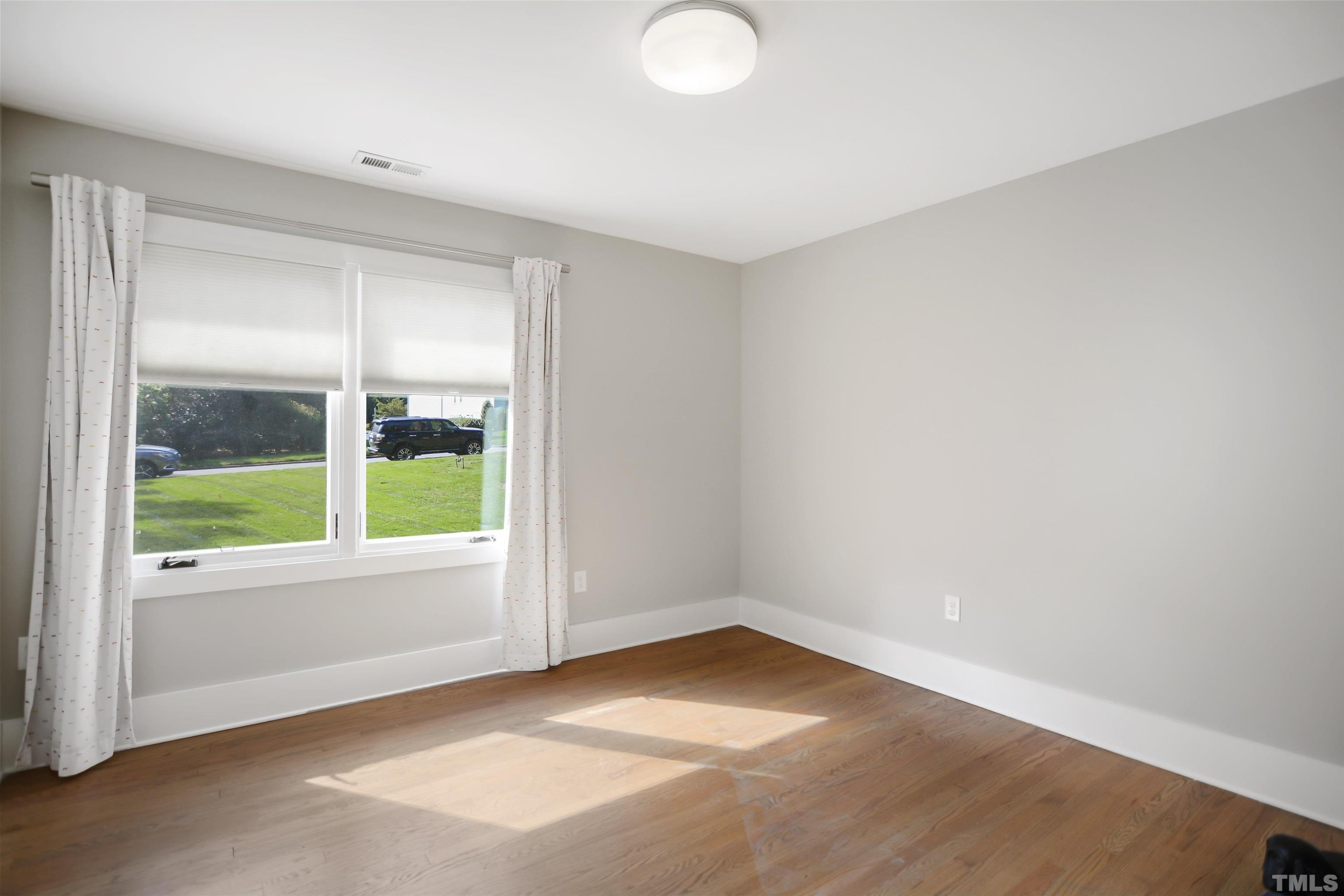 3210 Hampton Road Raleigh, NC 27607 - Photo 17 of 34 an empty room with a window