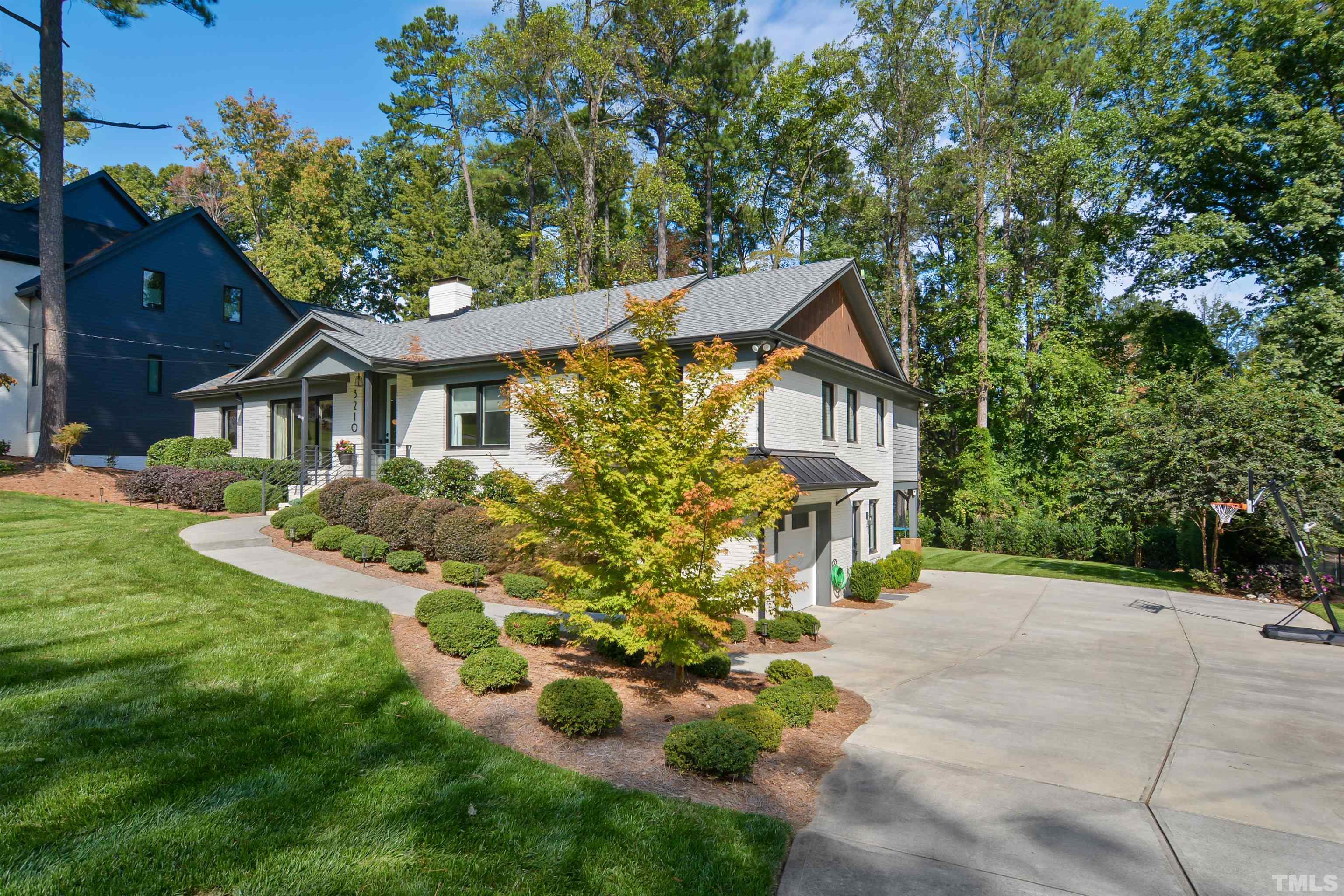 3210 Hampton Road Raleigh, NC 27607 - Photo 2 of 34 a front view of a house with a garden