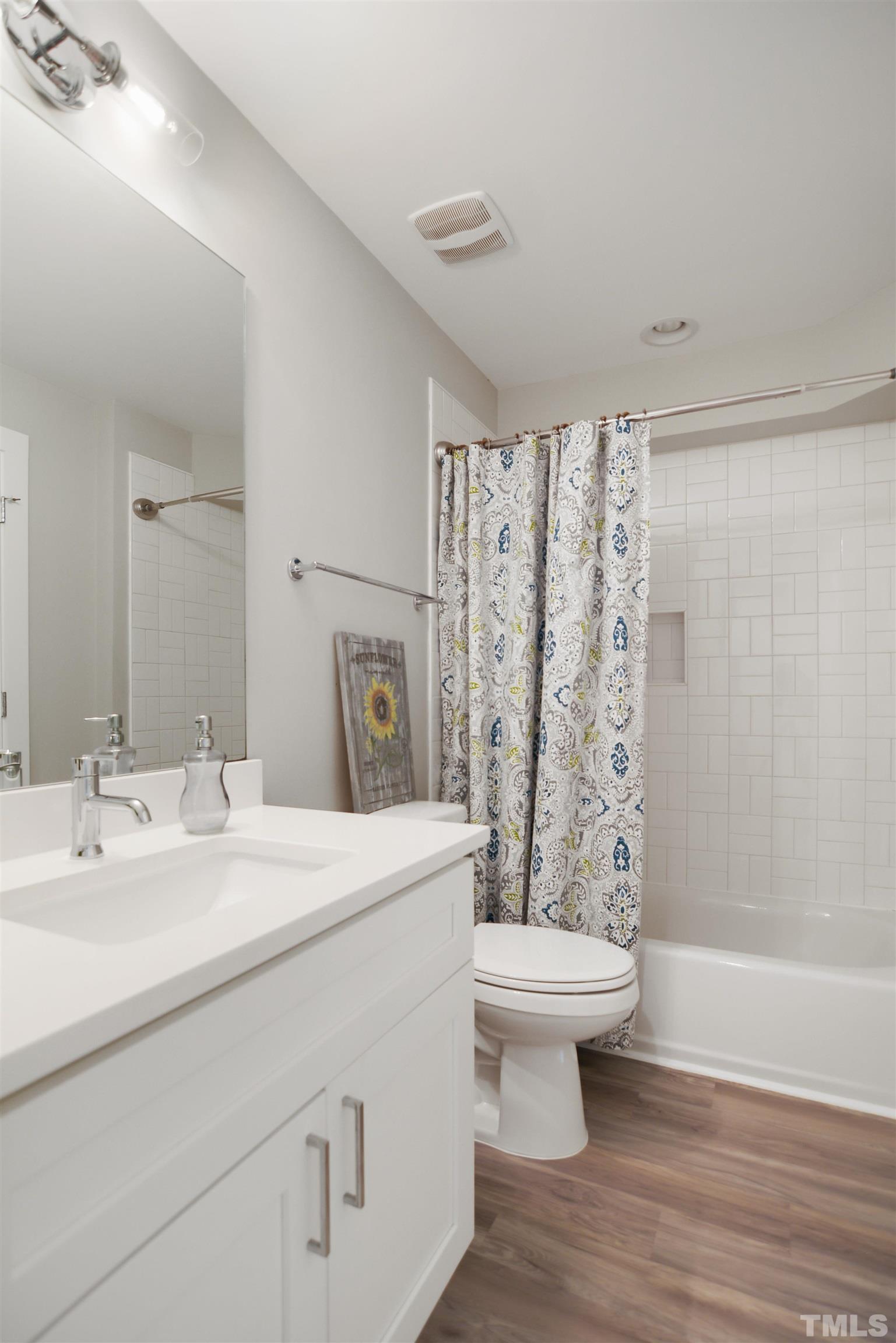 3210 Hampton Road Raleigh, NC 27607 - Photo 26 of 34 a bathroom with a sink toilet and shower