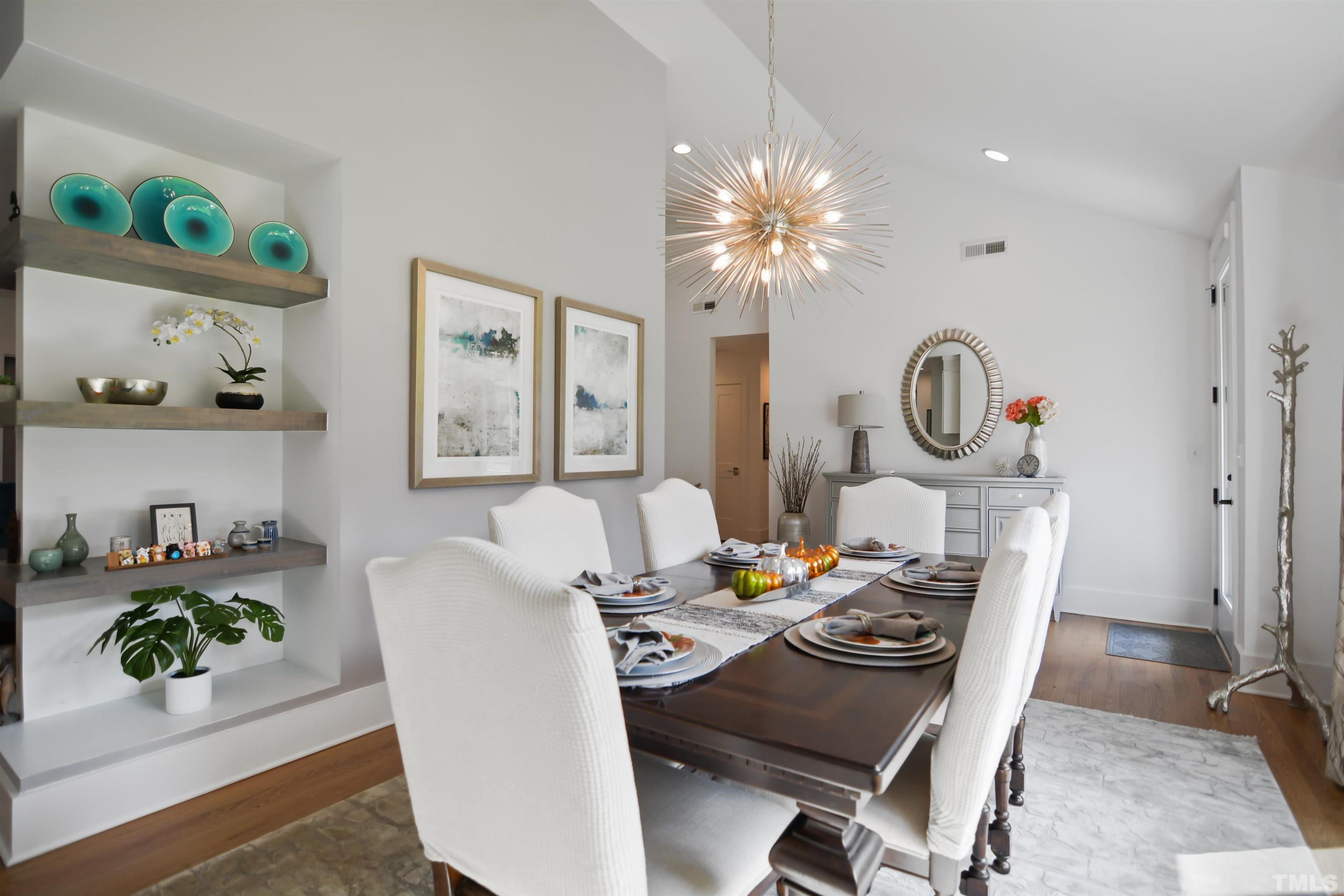 3210 Hampton Road Raleigh, NC 27607 - Photo 5 of 34 a view of a dining room with furniture a chandelier and wooden floor