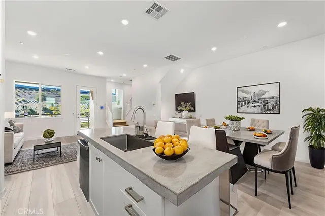 a view of a balcony with table and chairs