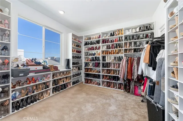 a bedroom with bed and a window