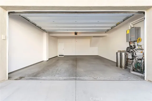 an aerial view of a house a swimming pool and outdoor seating