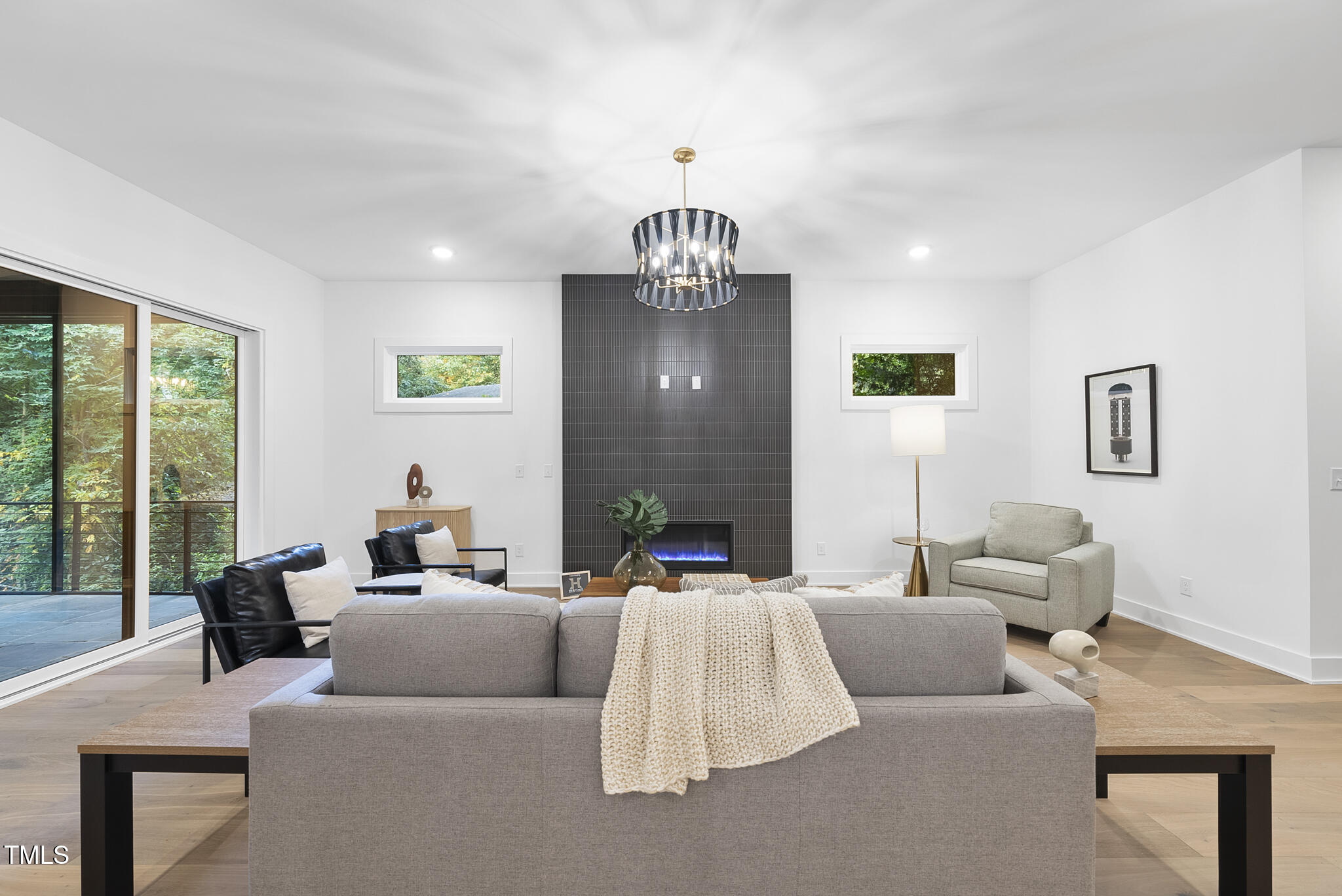 2603 Mayview Road Raleigh, NC 27607 - Photo 11 of 44 a living room with furniture and a chandelier