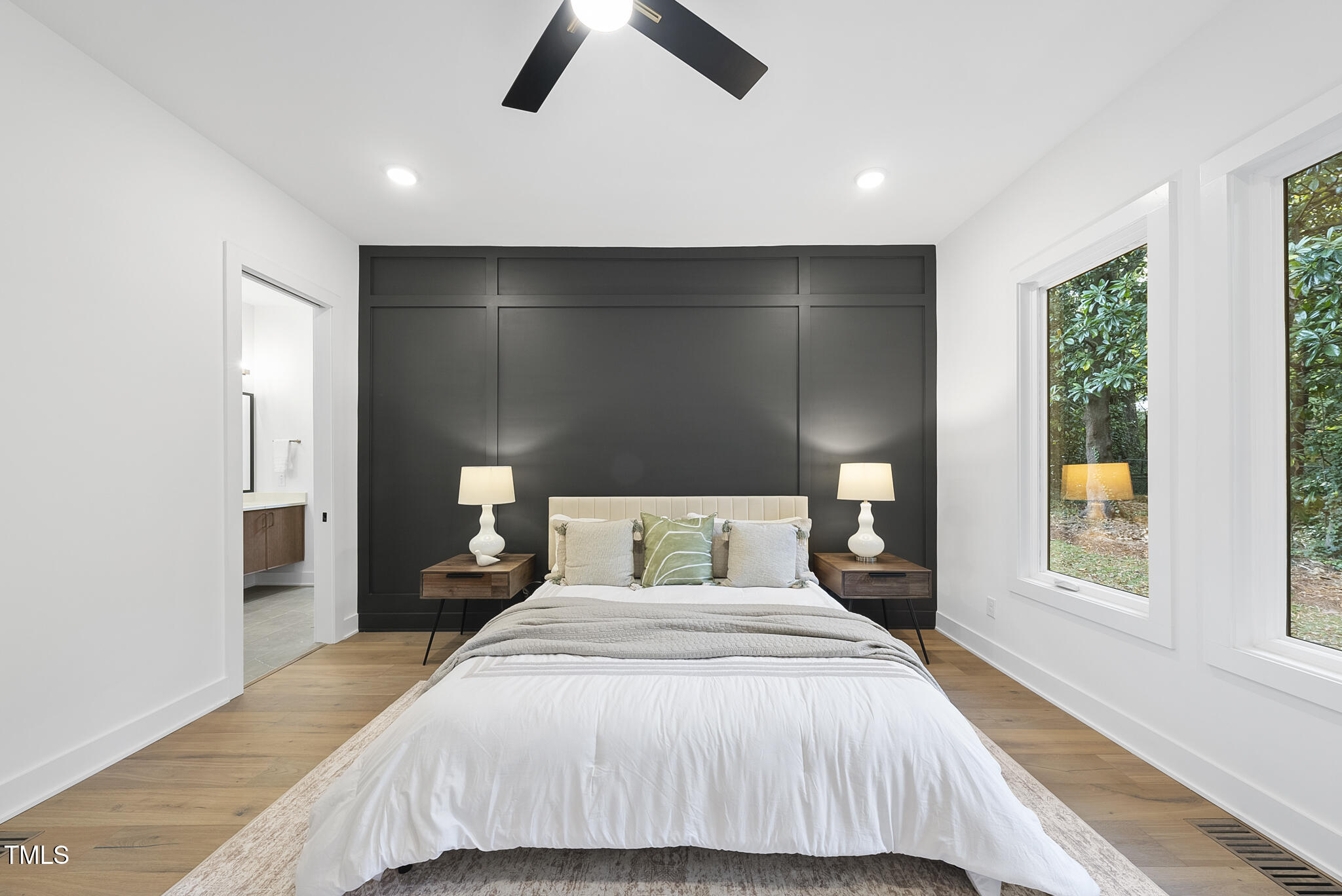 2603 Mayview Road Raleigh, NC 27607 - Photo 14 of 44 a bedroom with a large bed and a window