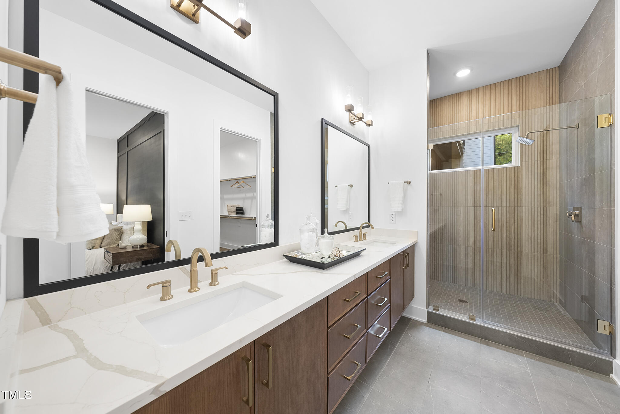 2603 Mayview Road Raleigh, NC 27607 - Photo 16 of 44 a bathroom with double vanity sinks and a shower