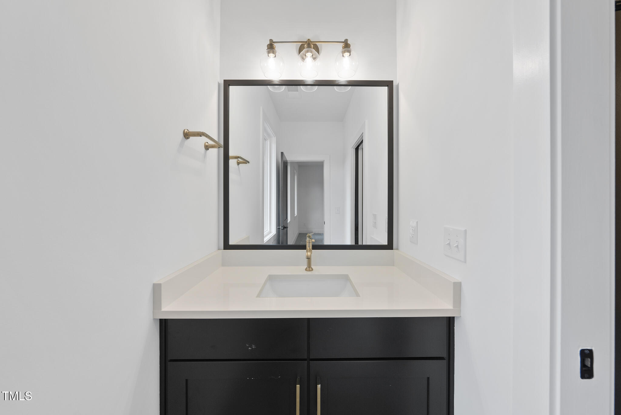 2603 Mayview Road Raleigh, NC 27607 - Photo 29 of 44 a bathroom with a sink and a mirror