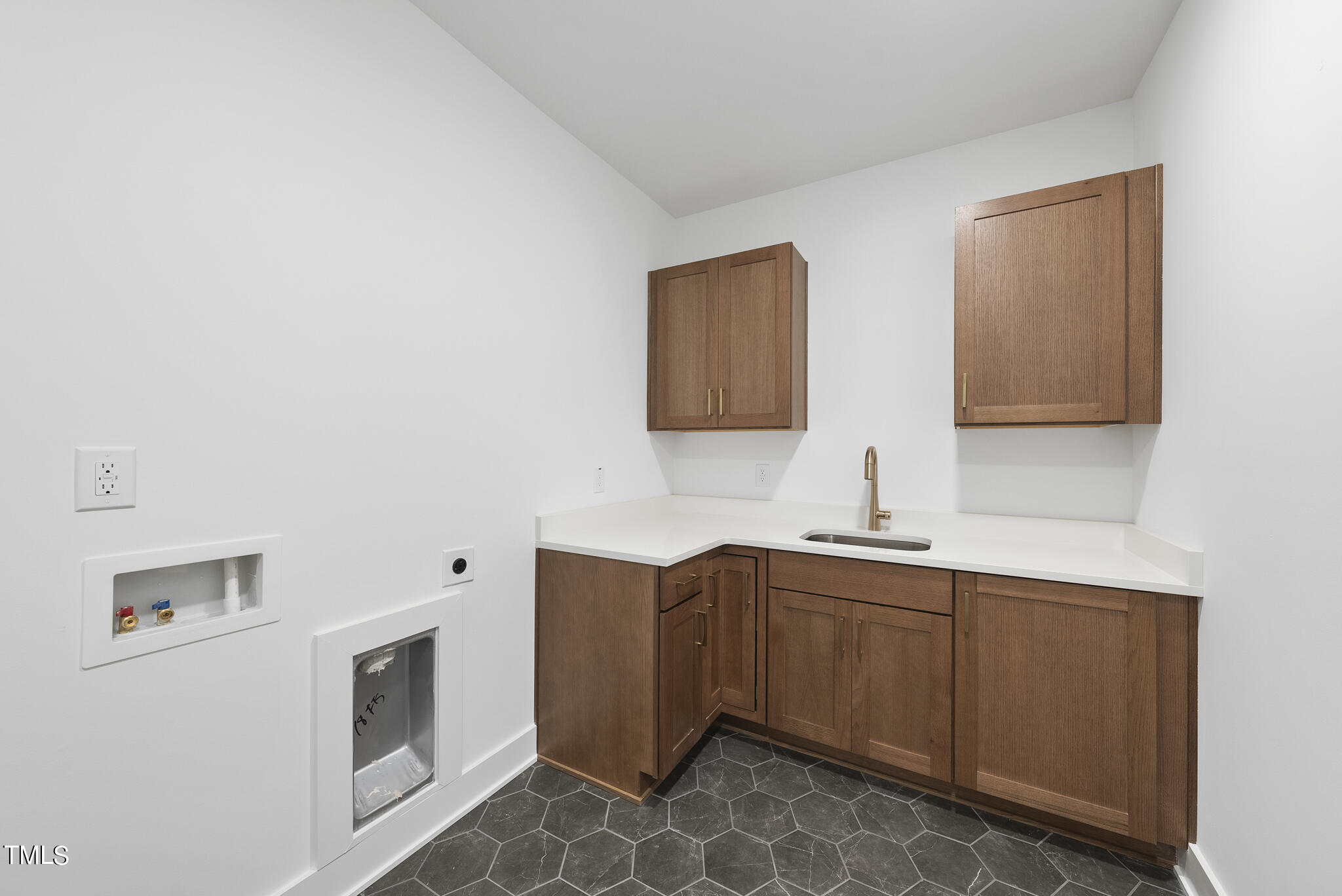 2603 Mayview Road Raleigh, NC 27607 - Photo 37 of 44 a kitchen with a sink and cabinets
