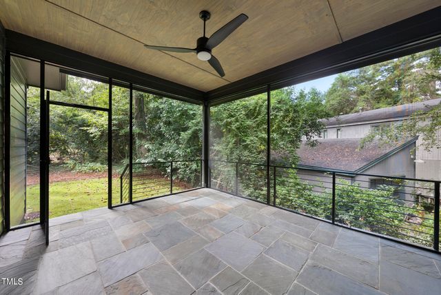 a view of porch with a floor to ceiling window and city view
