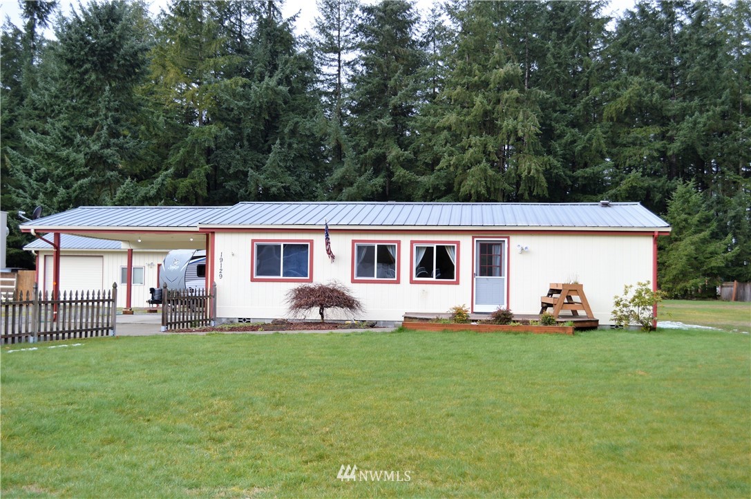19129 Loganberry Street Southwest Rochester, WA 98579 - Photo 1 of 25 a front view of house with yard outdoor seating and green space